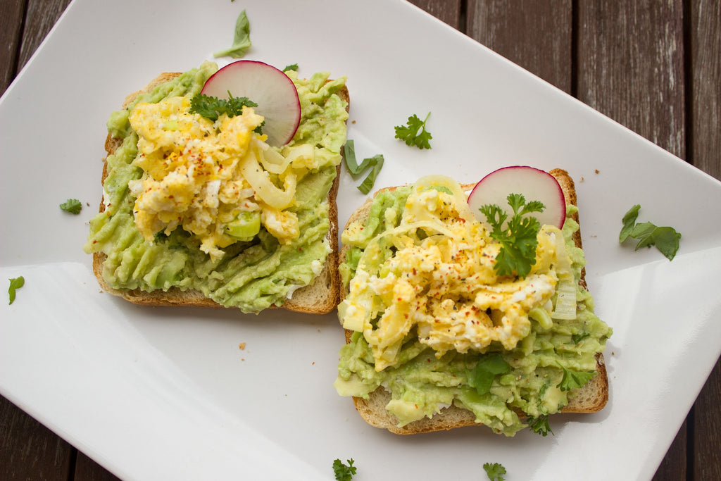 Scrambled eggs and avocado on toast